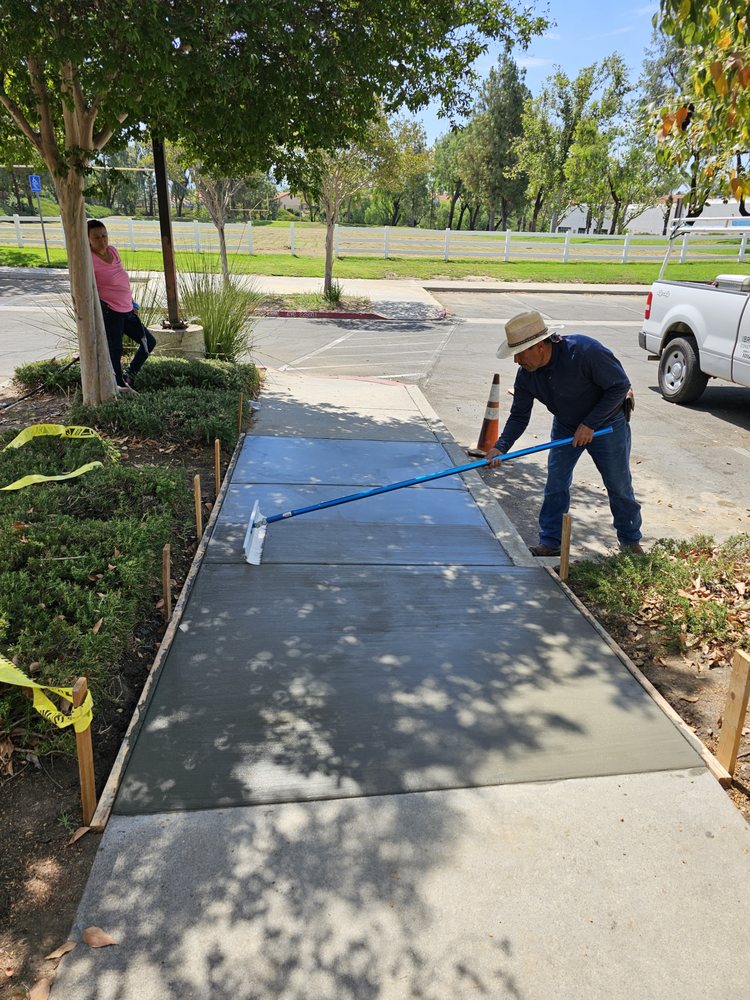 Concrete finishing work on park project by IBR Saldana